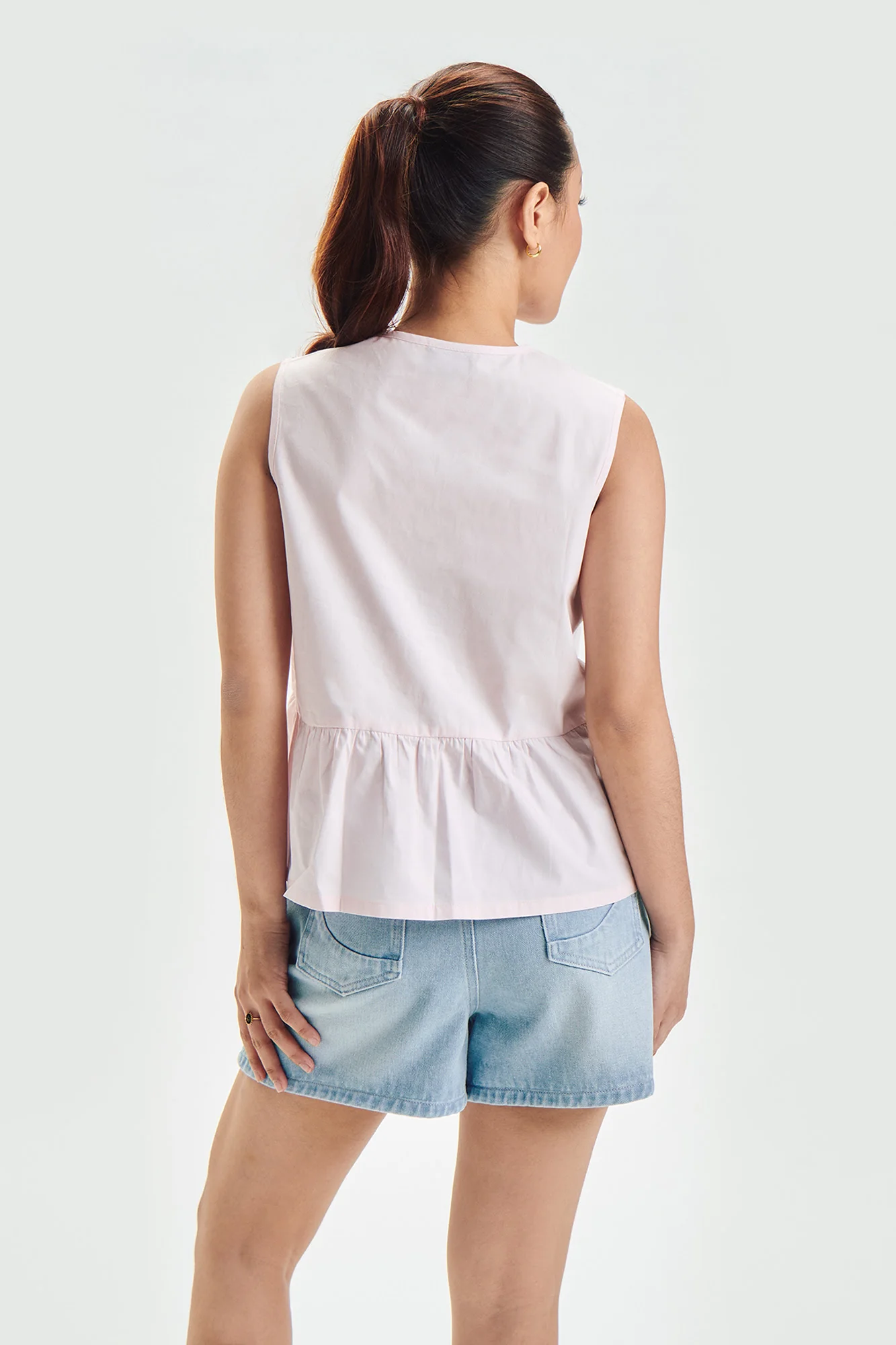 Sleeveless Peplum Top with Bows - Image 3